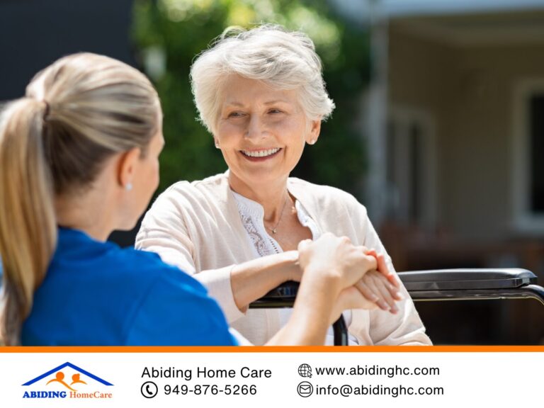 A compassionate caregiver providing non-medical home care to a smiling senior at home.